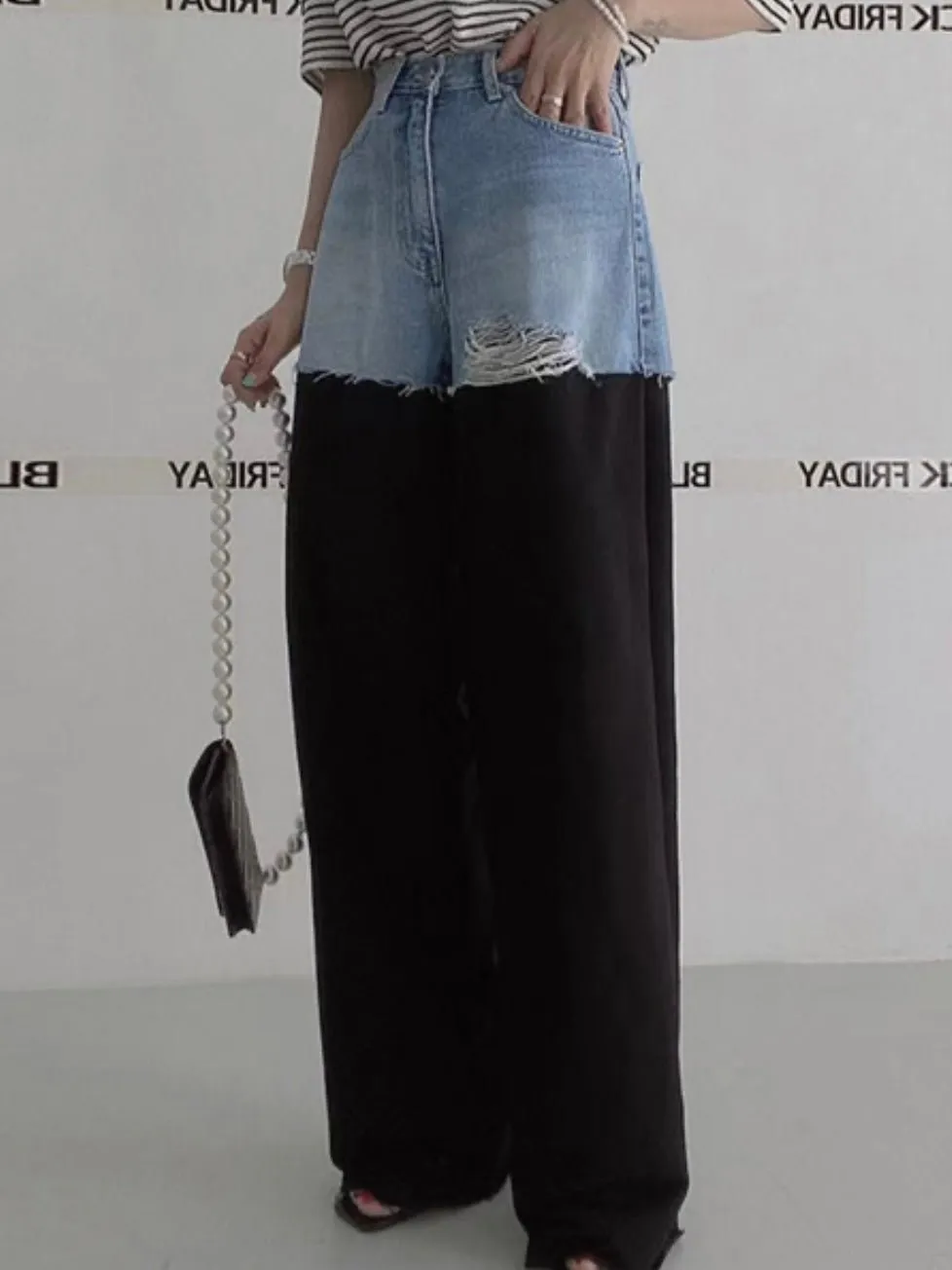 Blue jeans detail and black pants